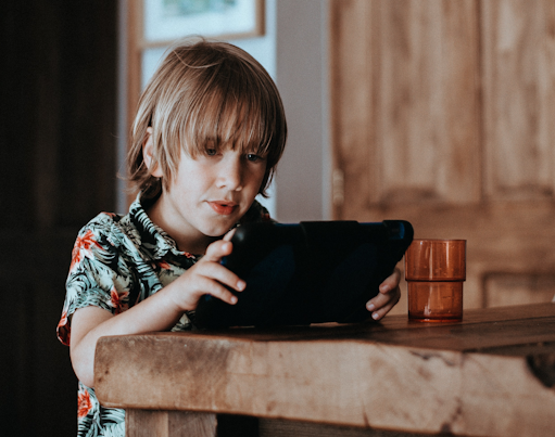 A boy watching a tablet computer