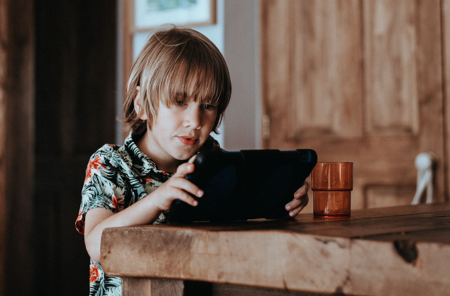 A boy watching a tablet computer