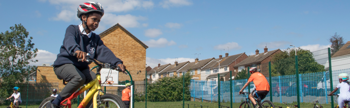 Trainees cycling around playground 1